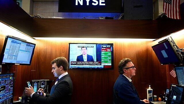 US stocks close mixed with Nasdaq near record as investors weigh new Fed guidance