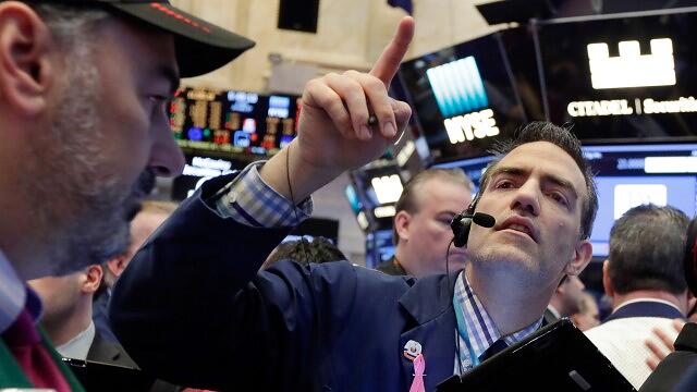 Stock futures trade lower on Fed rate policy, Ukraine concerns