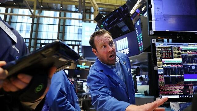 US stocks reverse losses to close higher after investors digest rate hike and cheer crucial Russia bond payment