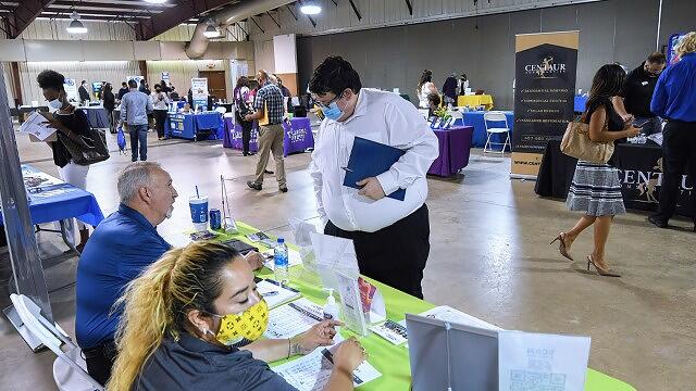 Jobless claims inch lower to 214,000 as workers remain in high demand