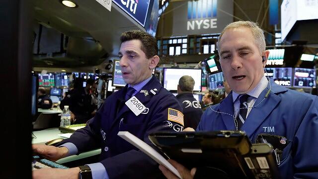 Stock futures trade cautiously the day after Fed hike